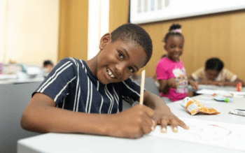 A child plays and works on a fun activity.