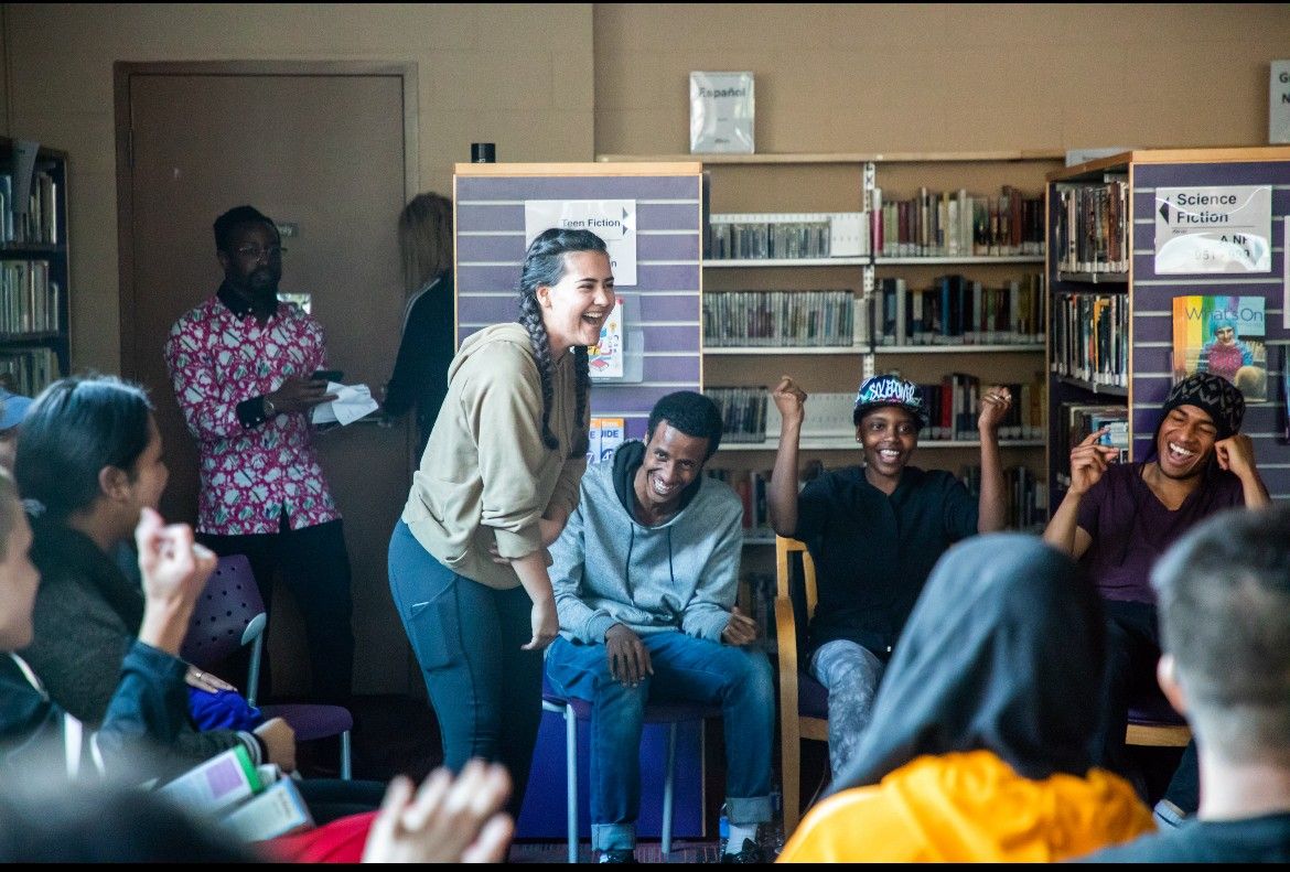 teens laughing at a poetry program